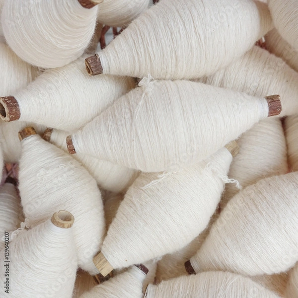 Fototapeta Multicolored bobbins of sewing cotton threads