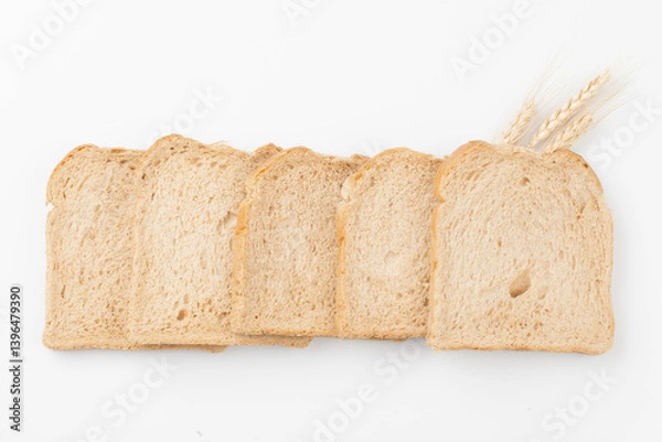 Fototapeta A staple bread made by mixing yeast into flour, kneading it, and baking it.