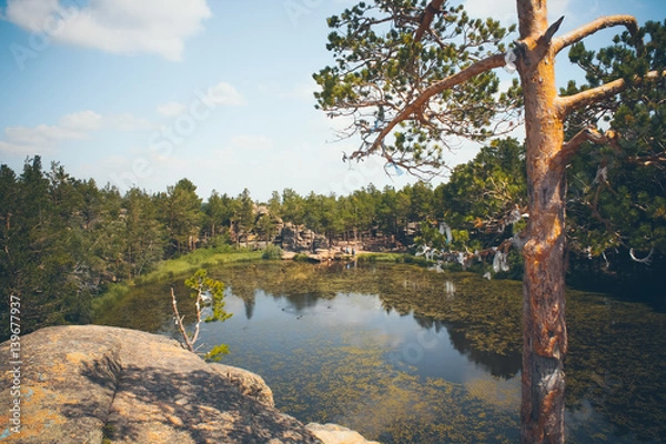 Fototapeta Mountain lake in the background of mountains and sky