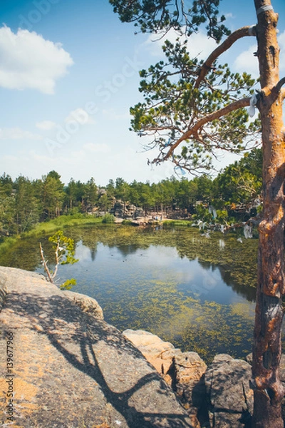 Fototapeta Mountain lake in the background of mountains and sky