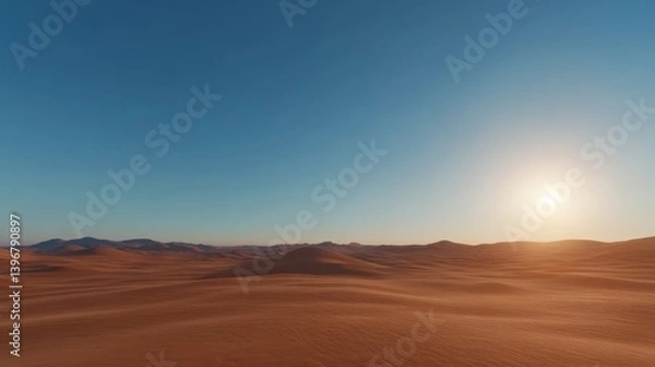 Fototapeta Vast golden sand dunes roll toward the horizon under a clear blue sky, capturing the calm and beauty of the desert during sunset