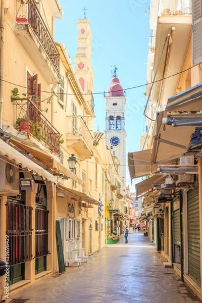 Obraz KERKYRA, CORFU, GREECE - Mart 4 2017: Tourists walking and shopping on narrow streets in the historical Kerkyra city center in Corfu near the Cathedral of St. Spyridon of Trimythous