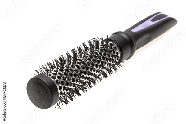Fototapeta Round hairbrush. Brush for straightening, adding volume or creating curls for medium and long hair. Barber tool. Isolated on white.