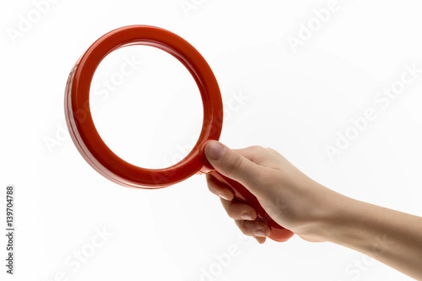 Fototapeta Isolated red Plastic Toy Magnifying Glass for Exploring and Catching Bugs on White Background.