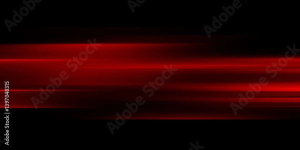 Fototapeta The effect of red light in fast motion on a black background. blurred abstract background with long exposure. neon light
