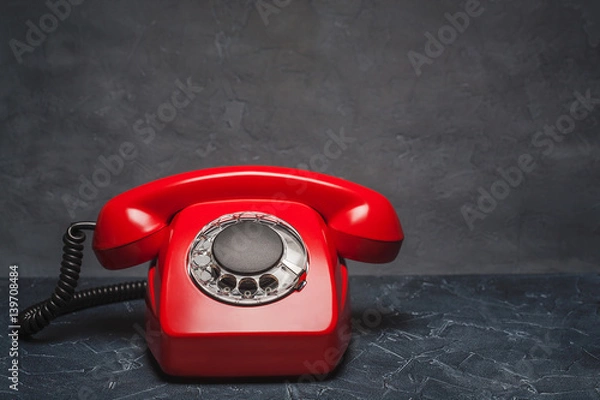 Fototapeta landline red phone on a gray wall background