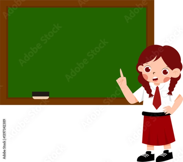 Fototapeta Cheerful Schoolgirl Presenting on Blank Chalkboard with Indonesian Elementary School Uniform