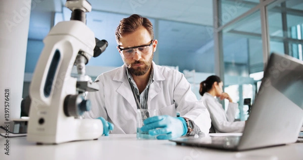 Fototapeta Scientist, man and chemistry with laptop for research, breakthrough or medical notes analysis. Biotech, laboratory and microscope with DNA for pharmaceutical RNA study or chemical experiment project