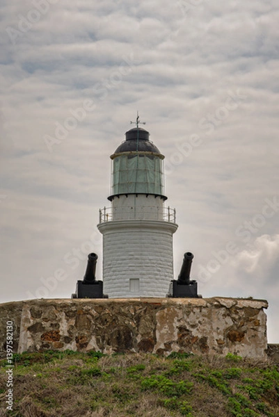 Fototapeta Dongju lighthouse and canons protect it