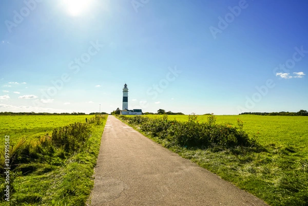 Fototapeta Langer Christian Lighthouse near Kampen on the North Frisian island of Sylt. Black and white lighthouse on the Geestkern.
