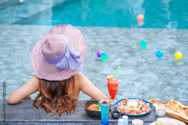 Obraz Beautiful Asain women with bikini enjoy summer vacation in the swimming pool.	