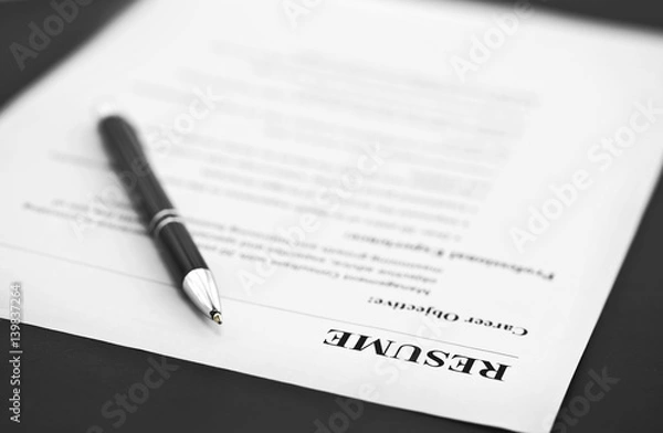 Fototapeta Closeup of Resume with Pen on the Table 