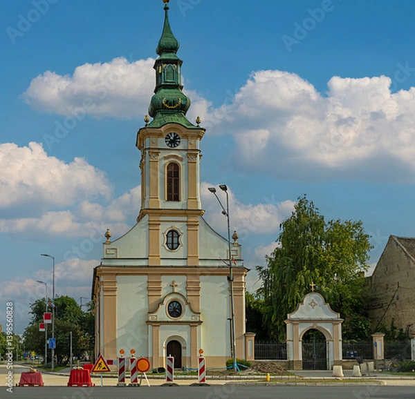 Fototapeta Empty road in countryside with Christian church in a back and traffic signs