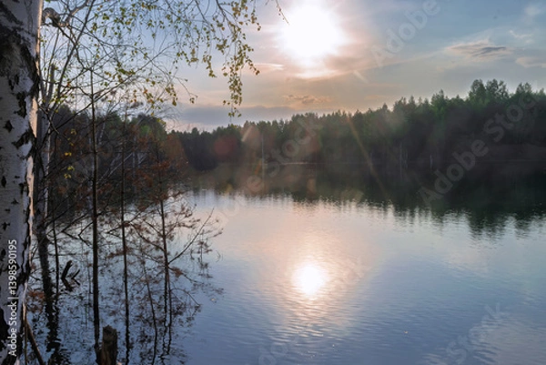 Fototapeta Autumn landscape - forest river and yellowed autumn trees at autumn evening, autumn landscape scene in sunny evening