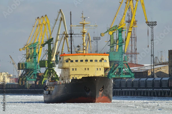 Fototapeta The powerful icebreaker breaks the ice.
