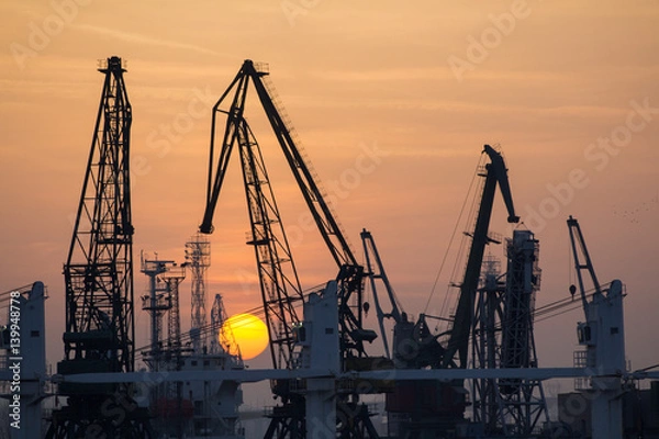 Obraz Industrial port dockyard with sunset