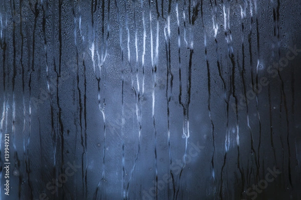 Obraz Dark blue rainy window with scary pattern of the raindrops paths