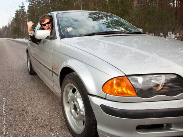 Obraz Aggressive driver in a left-hand driving car