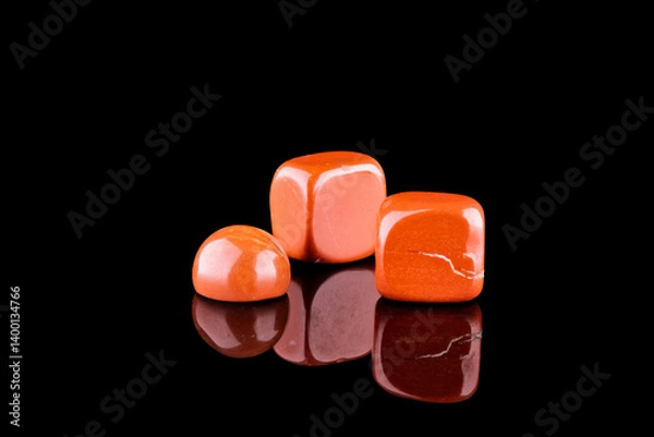 Fototapeta Red jasper polished chips isolated on black background
