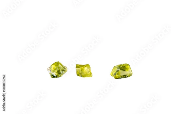 Fototapeta Green peridot (aka Olivine) polished chips isolated on white background