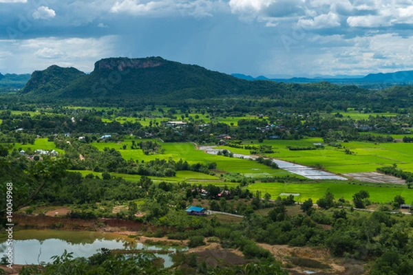 Fototapeta Thailand landscape of rural city and mountain under the cloudy sky