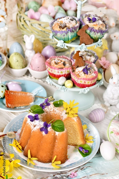 Obraz Easter table with traditional ring cake, muffins and decors
