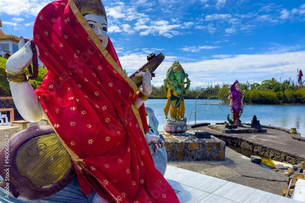 Fototapeta Saraswati Ganesh and Lakshmi Hindu deity statue in Grand-Bassin Temple, Mauritius Island, Indian ocean