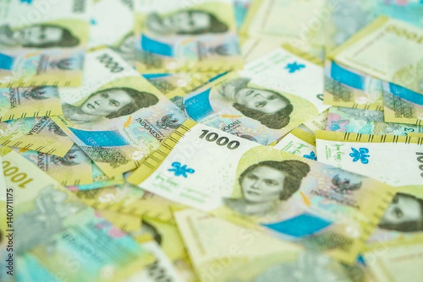 Fototapeta A stack of thousand rupiah banknotes, Indonesian money. suitable for background, finance, banking, cash, savings.