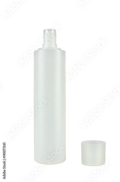 Fototapeta Open white plastic container for liquid substances with a lid beside it