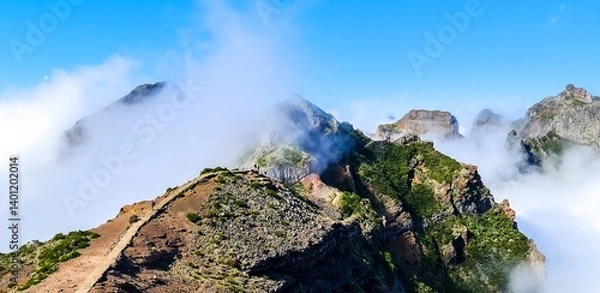 Obraz Panoramic view of the beginning of the famous hiking trail from Pico Arieiro to Pico Ruivo on Madeira, covered in clouds