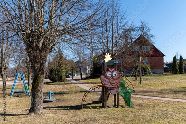 Obraz Colorful playground features whimsical owl structure in sunny park setting