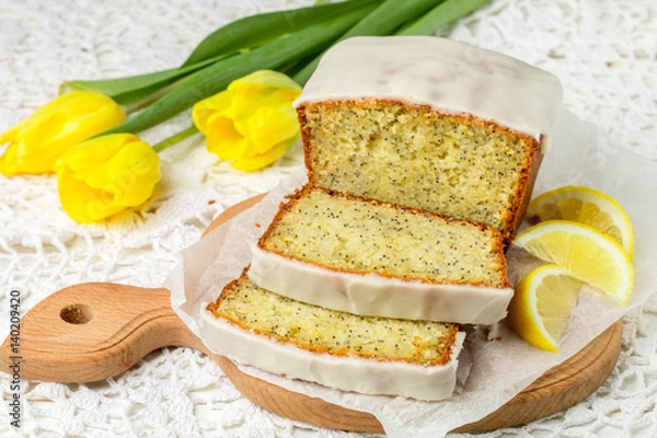 Fototapeta Homemade lemon cake with poppy seeds and sugar glaze. Selective focus