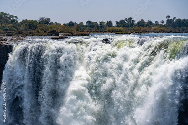 Fototapeta White water masses at the top of the victoria falls in zimbabwe crashing down the cliff face 
