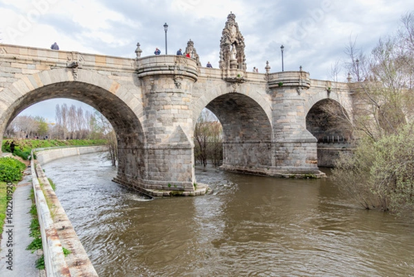 Fototapeta Manzanares River, on the verge of overflowing in some areas of Madrid, due to the rains of March 2025