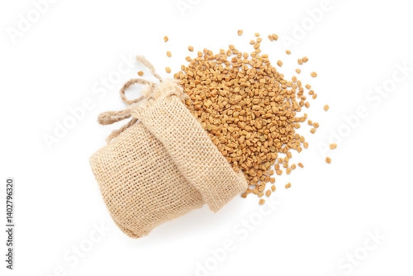 Obraz Close-up of Dry Organic Fenugreek seeds (Trigonella foenum-graecum), spilled out from a laying jute bag. Isolated on a white background.