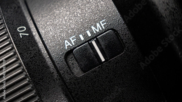 Fototapeta Closeup of the focus window on the camera lens. Close-up of the AF switch on the camera lens.