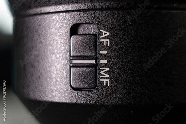 Fototapeta Closeup of the focus window on the camera lens. Close-up of the AF switch on the camera lens.