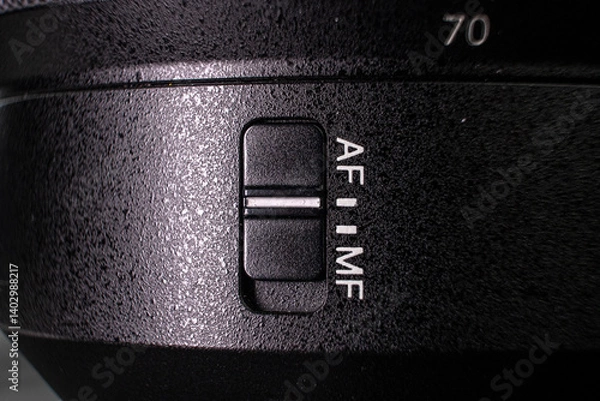 Fototapeta Closeup of the focus window on the camera lens. Close-up of the AF switch on the camera lens.