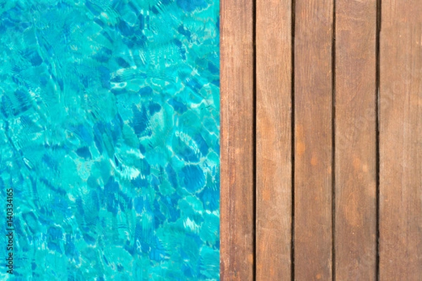 Fototapeta wooden platform at swimming pool with text space