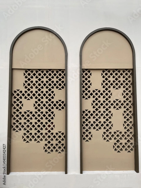 Fototapeta Arched building window with pattern inside