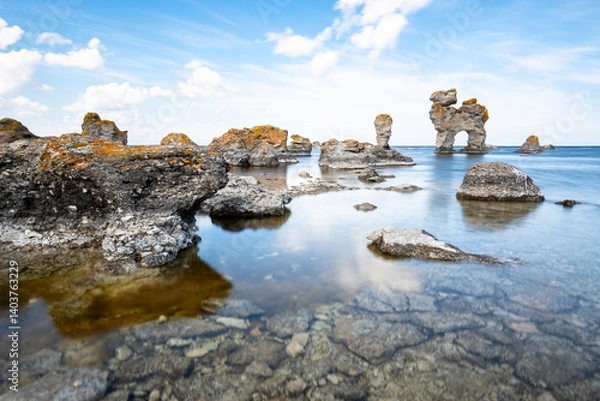 Obraz Limestone rocks formation raukar long exposure water reflection blurred clouds stones Baltic Sea Gotland Fårö island Sweden 