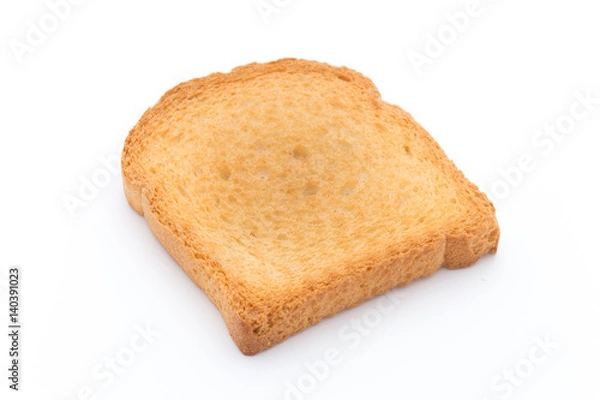 Fototapeta Slices of toast bread on wooden table, top view.