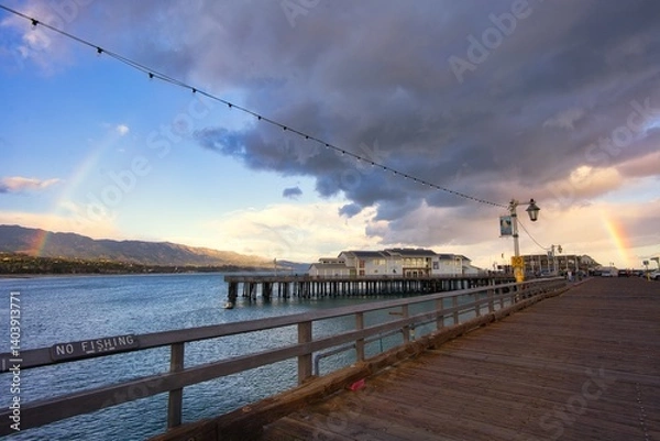 Obraz sunset on the pier with a rainbow