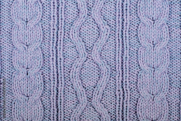 Obraz Sweater or scarf fabric texture large knitting. Knitted jersey background with a relief pattern. Braids in knitting . Wool hand- machine, handmade, blue.