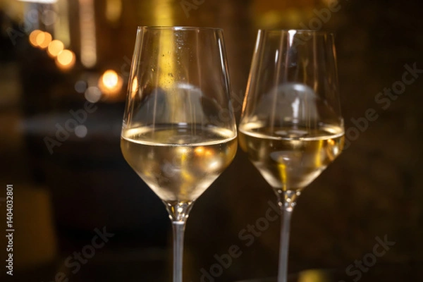 Fototapeta Visit of wine cellar, tasting of brut champagne sparkling wine produced by traditional method in underground caves close up