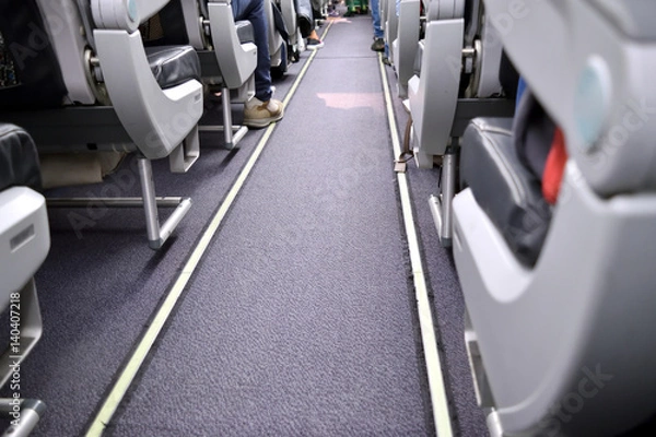 Obraz Passengers during a flight in an airplane