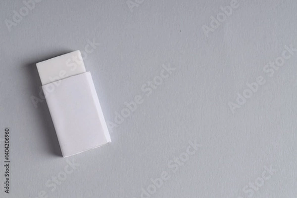 Fototapeta One eraser on grey background, top view. Space for text