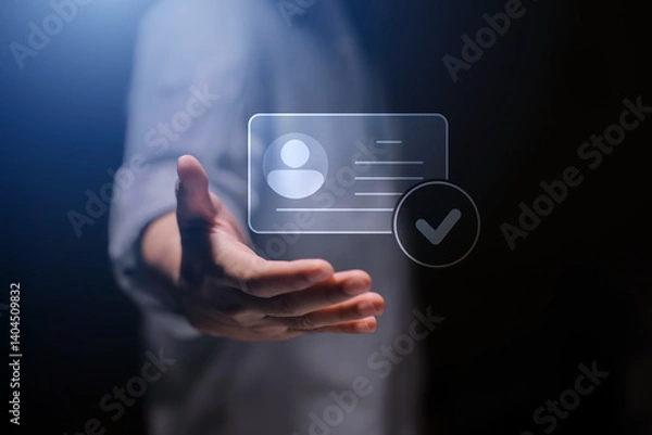 Fototapeta human hand holding digital identification card, with Checkmark Icons for Identity verification, ID card with checkmark. Personality approve. Employee badge.