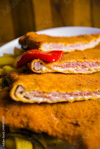 Fototapeta Delicious typical breaded and filled veal meat - Asturian cachopo