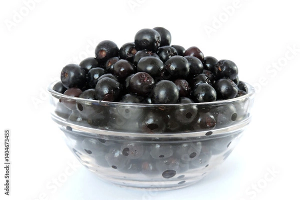 Obraz Fresh ripe aronia berries decorated in a glass bowl, white background, side view